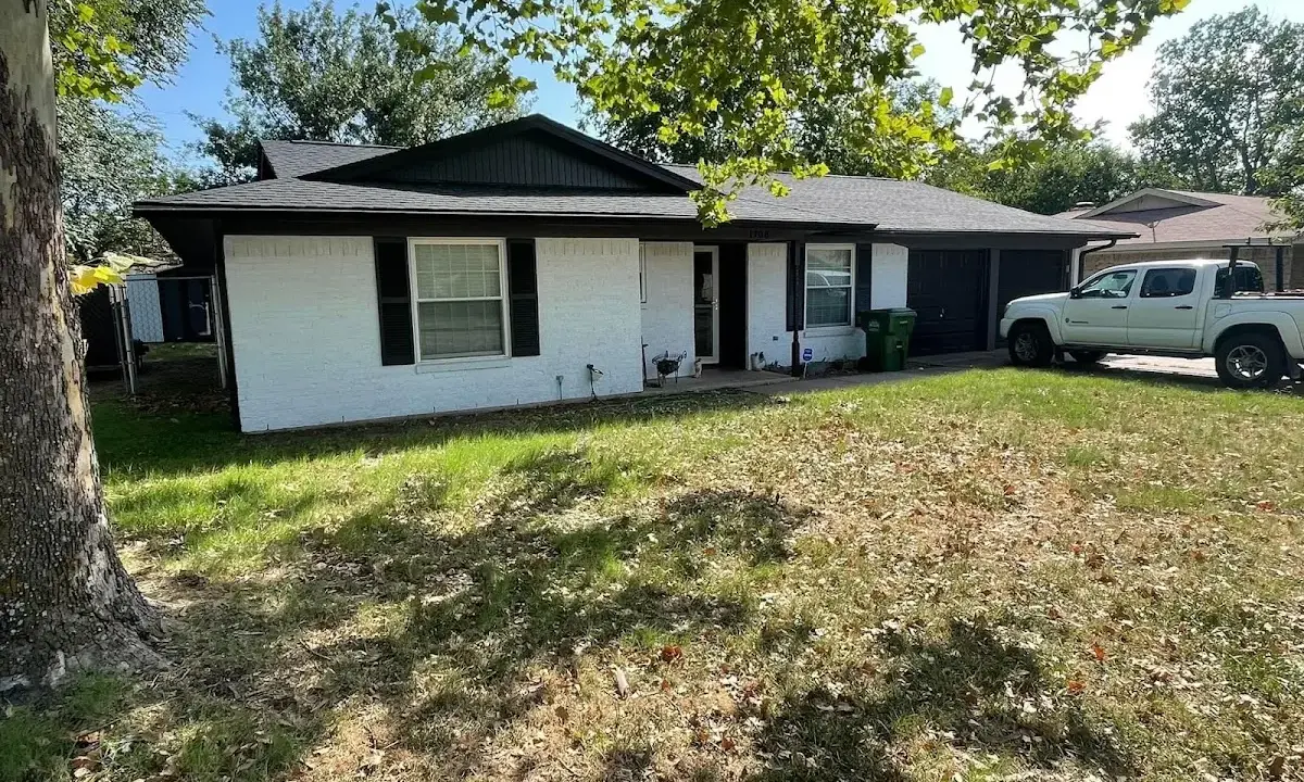 Professional roofing crew working on a residential roof in Tucson